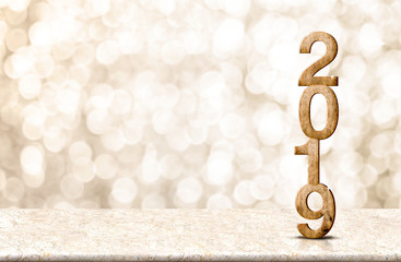 Happy New Year 2019 wood with sparkling star on marble table with gold bokeh background,Holiday...