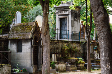 Paris, France - August 10, 2017. Tombs and monuments at old Montmartre cemetery which opened in...