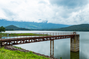 Obraz na płótnie Canvas The iron bridge in the reservoir at the Huai Pa Daeng Reservoir , Phetchabun in Thailand.