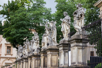 Fototapeta na wymiar Stone statue of apostles in the front of Church of St.Paul and St Peter in old town center, Krakow, Poland