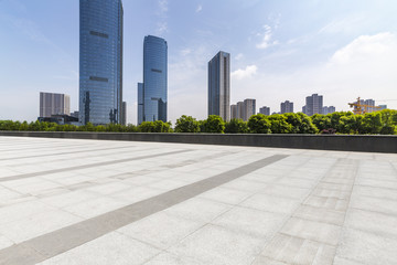 Panoramic skyline and modern business office buildings with empty road,empty concrete square floor