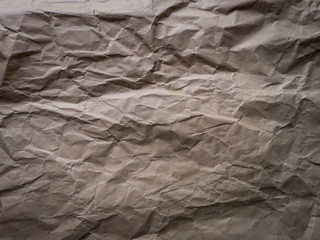 Fototapeta na wymiar Details of crumpled white paper on black.