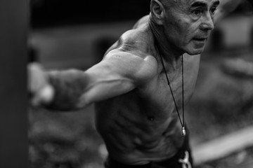 Fototapeta na wymiar Senior man exercising outdoors