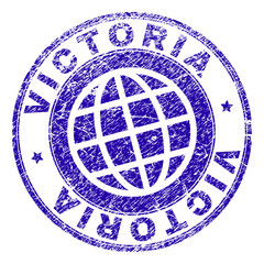 VICTORIA stamp imprint with distress texture. Blue vector rubber seal imprint of VICTORIA caption with grunge texture. Seal has words arranged by circle and planet symbol.