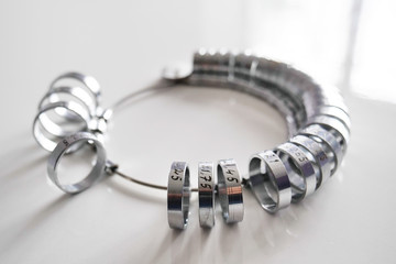 Close up of a deck of rings made to measure the diameter of the fingers. Concept: Goldsmith,...