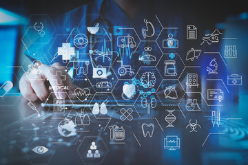 smart doctor hand working with modern laptop computer in modern office with virtual icon diagram