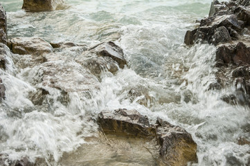 wave and drops at the beach