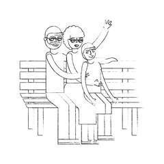 grandparents with grandson sitting on bench