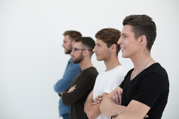 man smiling with a group of friends in a row