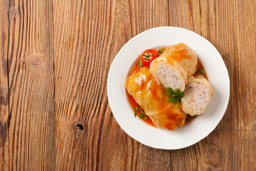 Traditional stuffed cabbage with minced meat and rice, served in a tomato sauce.