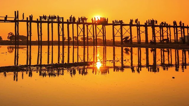 4K Time lapse of U Bein Bridge that is a wooden bridge across Ayeyarwady river in Amarapura where is apart of Mandalay, Myanmar.