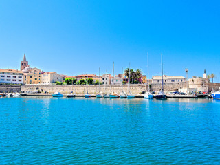 Fototapeta na wymiar View of the city of Alghero. Shot from the sea. Sardinia, Italy.