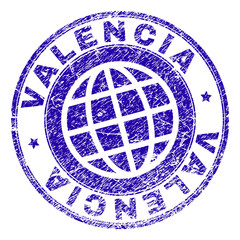 VALENCIA stamp imprint with grunge texture. Blue vector rubber seal imprint of VALENCIA title with corroded texture. Seal has words arranged by circle and globe symbol.