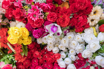 Colorful fabric flower wallpaper background.