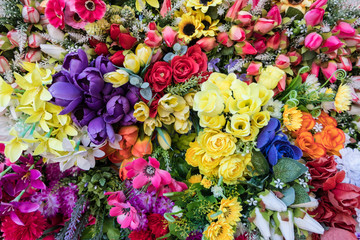 Colorful fake flower wallpaper background.