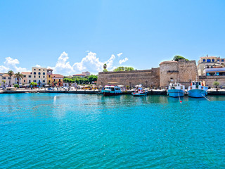 Fototapeta na wymiar View of the city of Alghero. Shot from the sea. Sardinia, Italy.