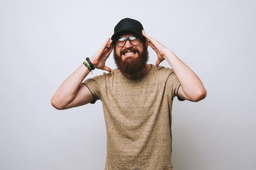Bearded man suffering form pain in head