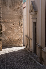 Sun light on a medieval town alley.