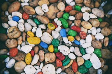 Colorful pebbles background or colored gravel background