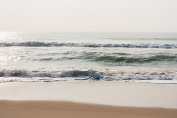 Glistening waves on beach - Glistening sea waves on a tropical beach in the morning.