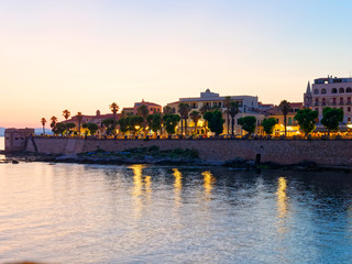Obraz premium View of the promenade and the old walls of alghero. Alghero, Sardinia, Italy.