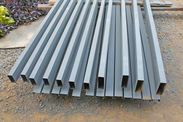 Obraz premium Steel pile prepare for make roof structure at construction site grey background 