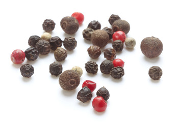 heap of peppercorns isolated on white background