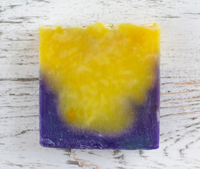 Natural handmade soap bar on wooden background