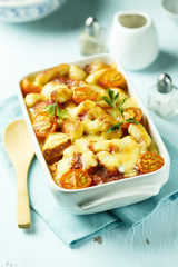 Homemade pasta bake with cheese and tomatoes