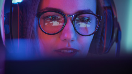 Beautiful Friendly Pro Gamer Girl Does Video Game Gameplay stream, Wearing Glasses. Attractive Geek...