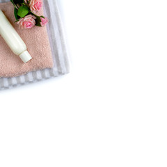 Professional treatment lotion moisturizer natural spa wellness cosmetic with flowers and towel