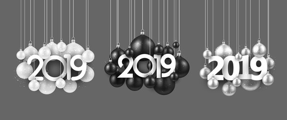Set of festive 2019 new year signs with Christmas balls on grey.