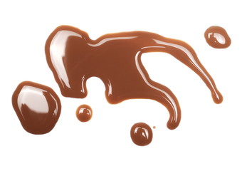 Spilled chocolate milk puddle isolated on white background, top view