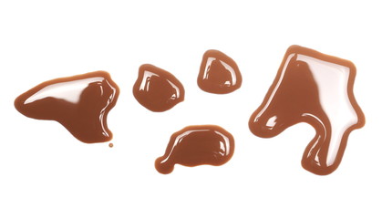 Spilled chocolate milk puddle isolated on white background, top view