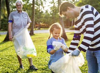 Kids picking up trash in the park