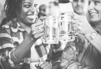 Friends cheering at bar together