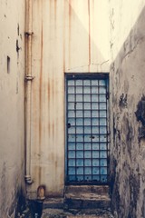 Rustic door and exterior of a house in Penang