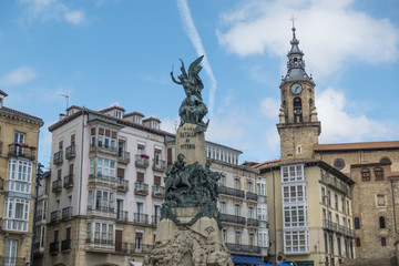 Monument and church in the Virgen Blanca square in Vitoria, Spain.