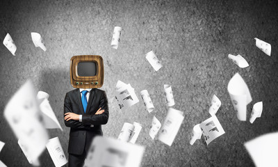 Businessman with old TV instead of head.