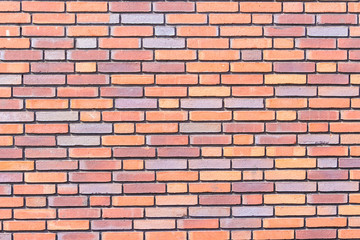 Brick wall background texture close up, colorful bricks