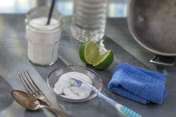 Baking soda, lemon with sponge and towel for effective and safe house cleaning and dishes