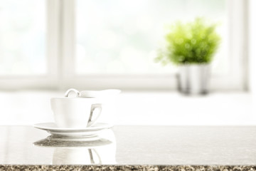 desk of free space and window background with small plant 