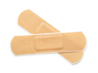 Top view of two beige adhesive bandages