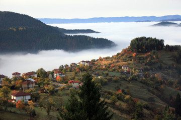 Autumn in the Rhodope Mountains, Bulgaria. Early morning. The mountain is covered with fog.