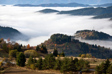 Autumn in the Rhodope Mountains, Bulgaria. Early morning. The mountain is covered with fog.