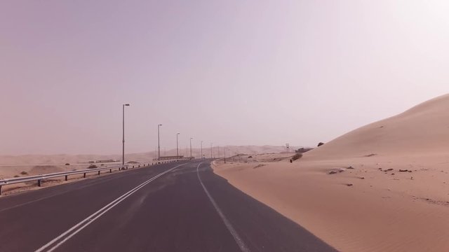 New road from Oasis Liwa to Moreeb Dune in Rub al Khali desert stock footage video