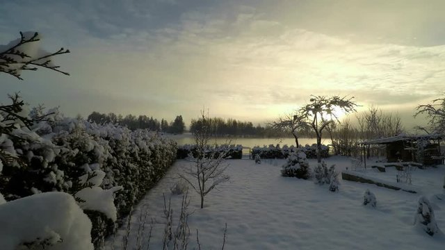 Fog and sunrise over the river during the winter. Timelapse
