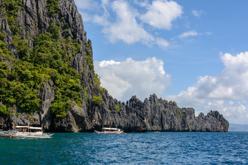 Fototapeta na wymiar Lagoon surrounded by rocks in El Nido Palawan. Philippine seascape with rocks. Tropical paradise in Asia