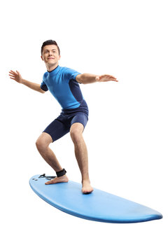 Teenage boy surfing