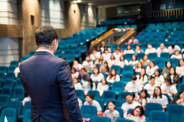 The Speaker Talking About Business Conference. Audience at the conference hall. Business and Entrepreneurship event.